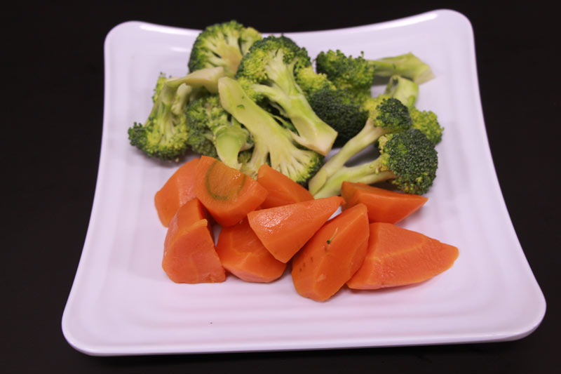 A Plate of broccoli and/or carrot