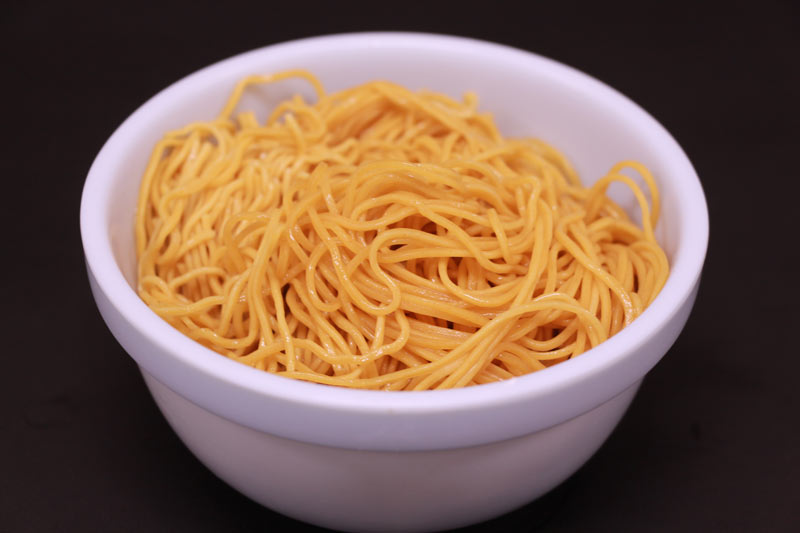 A bowl of Flat, glass, egg noodle (no soup)